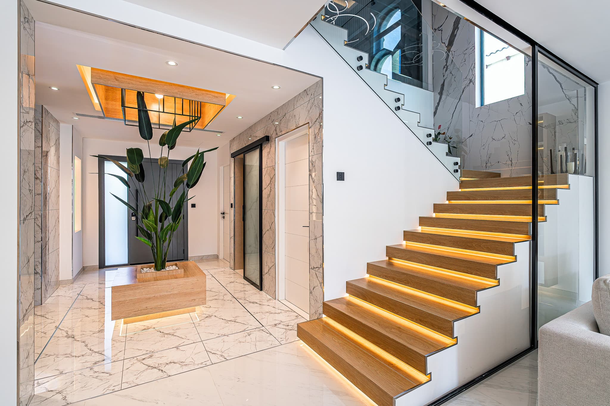 Villa entrance hall renovation Dubai - grand entrance with custom floating staircase